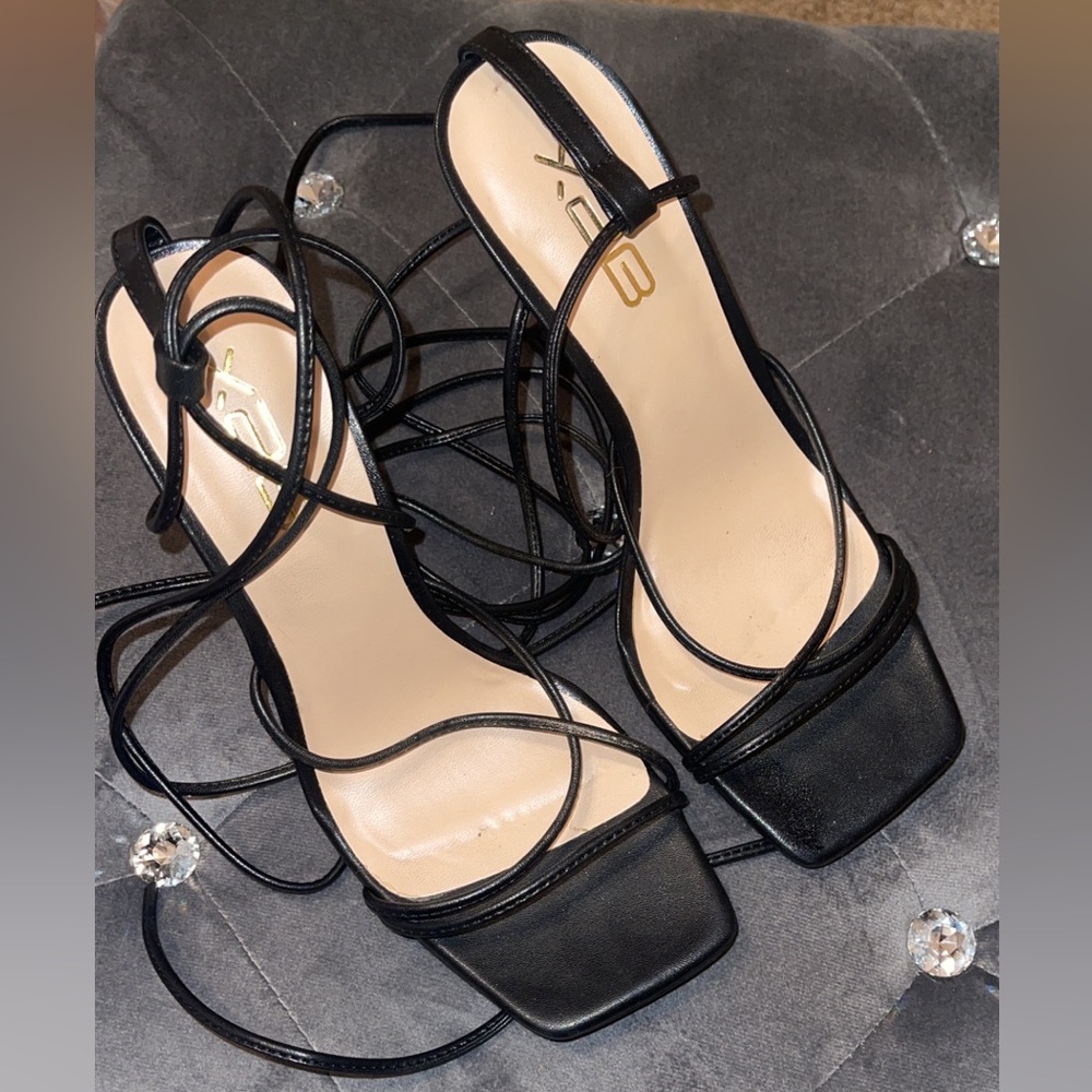 Woman’s strapped lace up heels